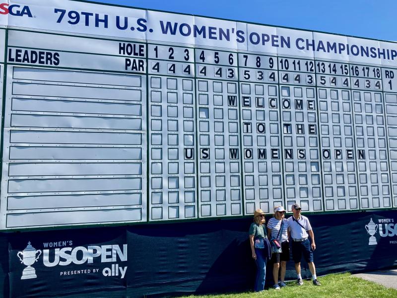 Jayne Limm, left, and Cheryl and Glenn Rowland pose for a photo taken by Jayne's husband Jeff Limm (not shown) in front of the giant old-fashioned scoreboard near the main entrance to the event. The four friends traveled May 30 from York, Pa., to watch the U.S. Women’s Open at Lancaster Country Club. They were part of yet another record-setting crowd for the USGA’s premier women’s tournament. FRITZ SCHRANCK PHOTO